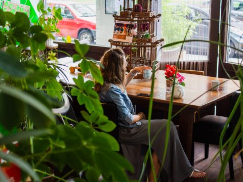 woman sitting near wooden table