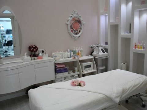 white wooden vanity table with mirror