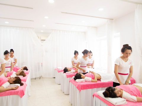 massage room with pink and white theme