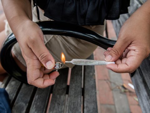 person holding silver and black lighter