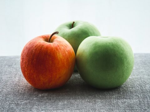 three green and red apple fruits